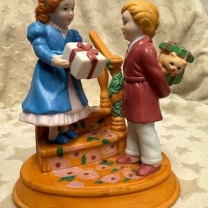Charming Ceramic Figurine with Gift Exchange